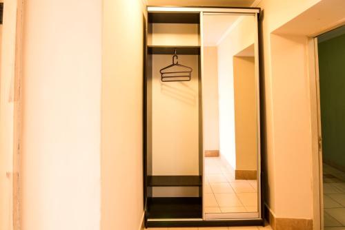 a mirror in a room with a hallway at Inter Hotel in Ternopilʼ