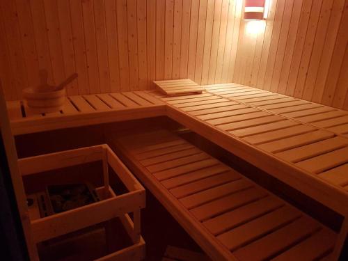 a sauna with two bunk beds and a light at Wellness Apartmány EMPORIO in Loštice