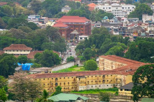 a view of a city with buildings and trees at Mount Palace in Kandy