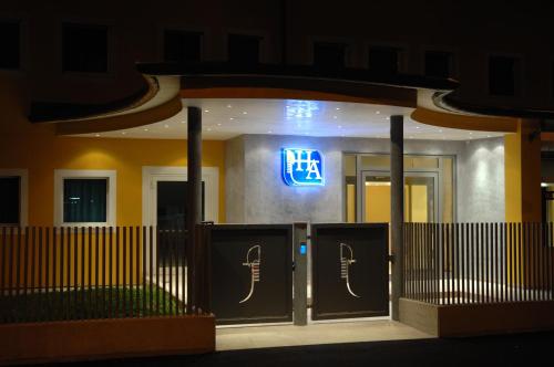 a hotel front door at night with a sign on it at Hotel Alverì in Mestre