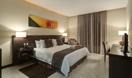 Cama o camas de una habitación en Studio Hotel Boutique