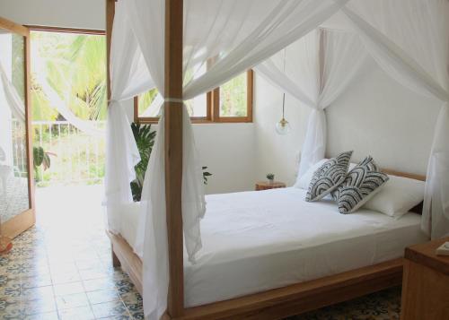Postel nebo postele na pokoji v ubytování Casa del Pavo Real Boutique Hotel