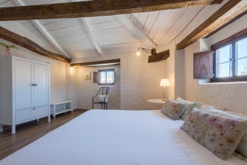 Кровать или кровати в номере La Casa de la Vieja - Alojamiento Rural 3 y 4 Estrellas