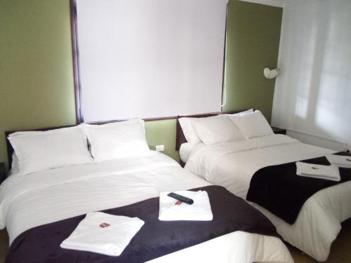 Ένα ή περισσότερα κρεβάτια σε δωμάτιο στο Hotel El Zaguan De La Rueca