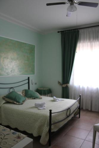 Ένα ή περισσότερα κρεβάτια σε δωμάτιο στο Il Casale del Nonno Bed&Breakfast