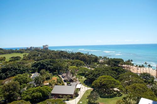 an aerial view of the beach and the ocean at Queen Kapiolani Hotel in Honolulu