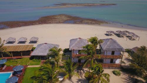 an aerial view of a resort on the beach at Manati in Barra Grande