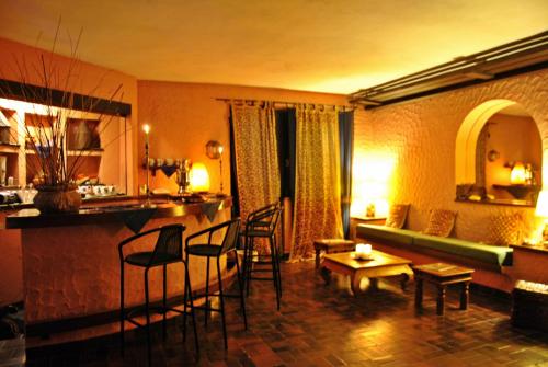 a living room with a couch and a table at Resort Le Picchiaie in Portoferraio