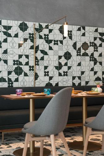 a dining room with a table and two chairs at The Sukhothai Shanghai in Shanghai