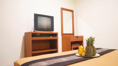 TV a/nebo společenská místnost v ubytování Pondok Mirah