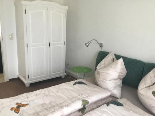 Ένα ή περισσότερα κρεβάτια σε δωμάτιο στο Harzer Grabenhaus