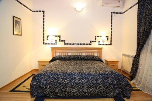 a bedroom with a bed in a room at Malika Prime Hotel in Samarkand