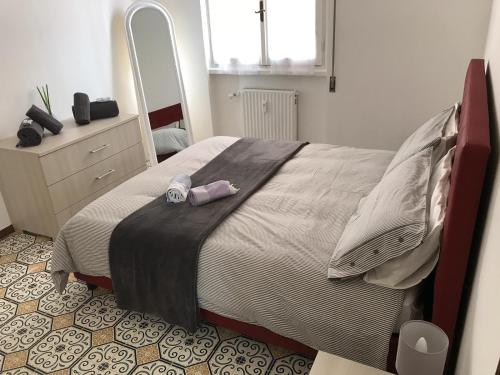 a bedroom with a large bed with a large mirror at Casa gli Scogli in Chiavari