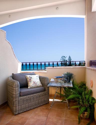 a living room with a couch and a table at Hotel Los Ángeles Denia in Denia