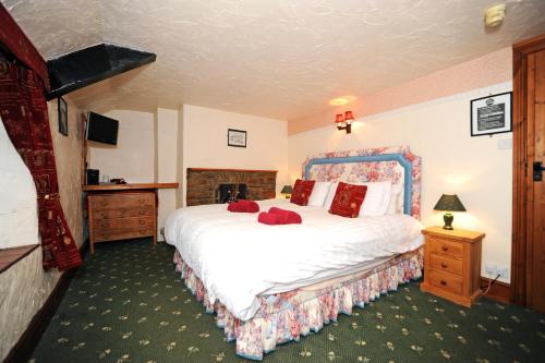 Ένα ή περισσότερα κρεβάτια σε δωμάτιο στο The West Country Inn