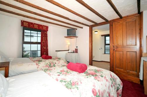 Ένα ή περισσότερα κρεβάτια σε δωμάτιο στο The West Country Inn