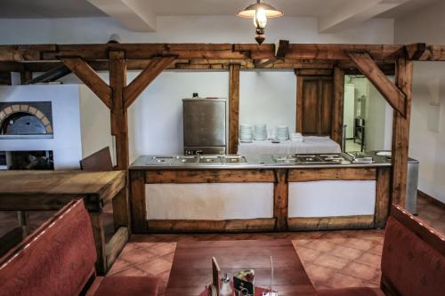 a kitchen with a counter top in a room at Penzión Teniscentrum in Tatranská Lomnica
