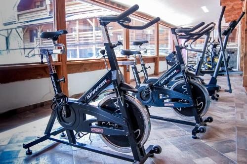 a row of bikes parked next to a window at Penzión Teniscentrum in Tatranská Lomnica