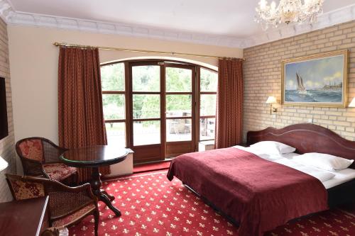 Postel nebo postele na pokoji v ubytování Hotel Amerika