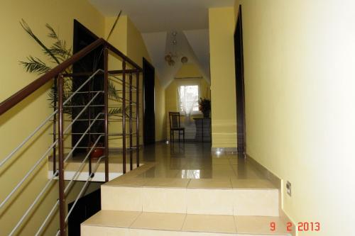 a hallway with a staircase in a house at Pokoje Hotelowe Wiktoria in Goczałkowice Dolne