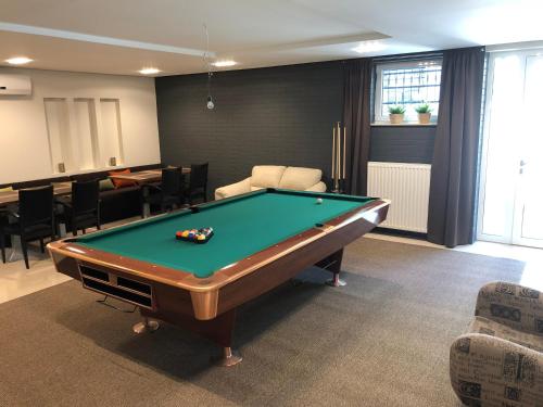 a billiard room with a pool table in it at Villa Mona Lisa in Hévíz