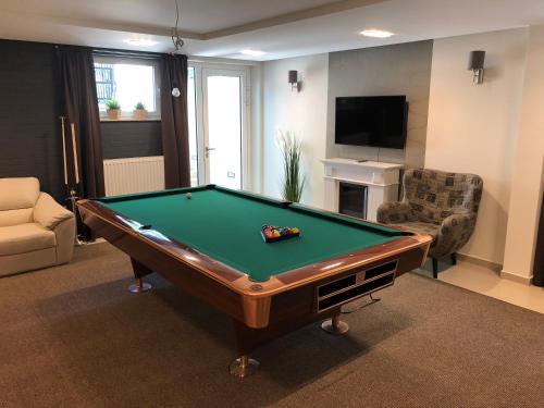a living room with a pool table in it at Villa Mona Lisa in Hévíz