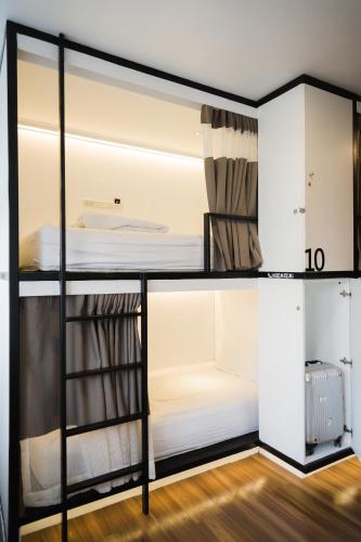 Ένα ή περισσότερα κρεβάτια σε δωμάτιο στο The Common Hostel