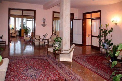 a living room with a couch and chairs and a table at Hotel Mediterranée in Taormina