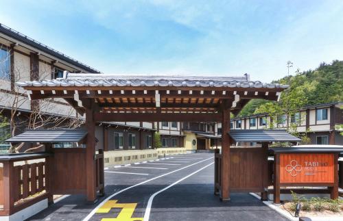 a wooden pavilion on the side of a road at TABINO HOTEL Hida Takayama in Takayama