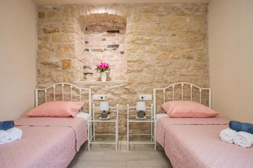 מיטה או מיטות בחדר ב-Villa Ane, Divine holiday