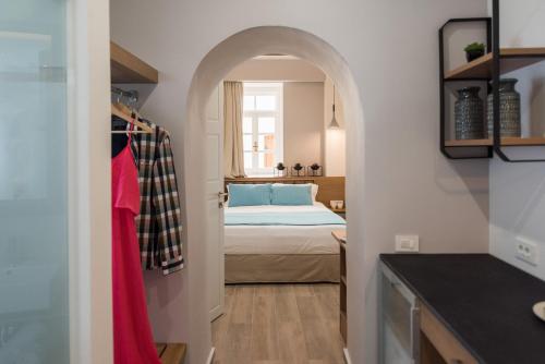 Ένα ή περισσότερα κρεβάτια σε δωμάτιο στο Harismari Cozy Hotel