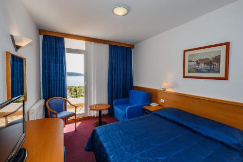 Postel nebo postele na pokoji v ubytování Hotel Medena Budget