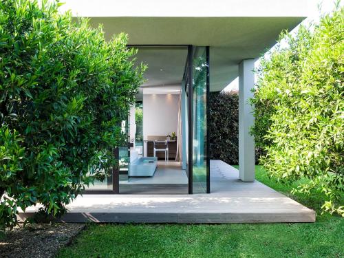 a pivot door in a house between two bushes at Zash Country Boutique hotel & SPA in Giarre