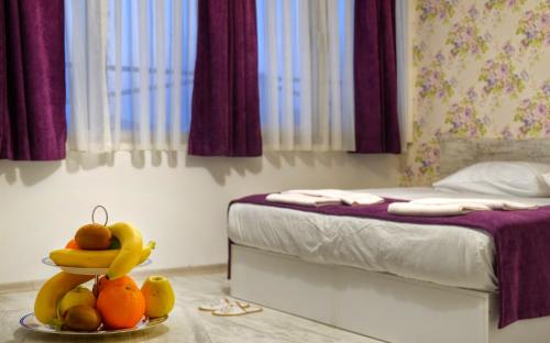 Postel nebo postele na pokoji v ubytování Hotel Abro Sezenler