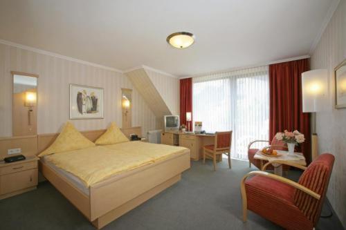 Postel nebo postele na pokoji v ubytování Hotel Dreyer Garni