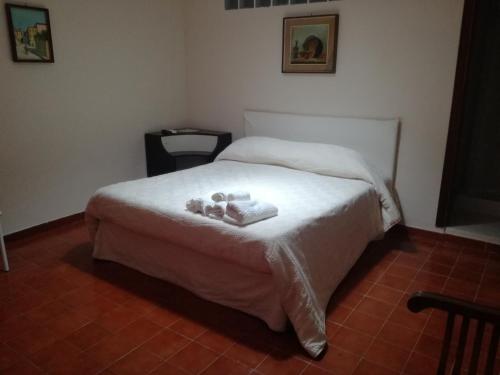 a bedroom with a bed with two teddy bears on it at Consoli Crispino in Francolise