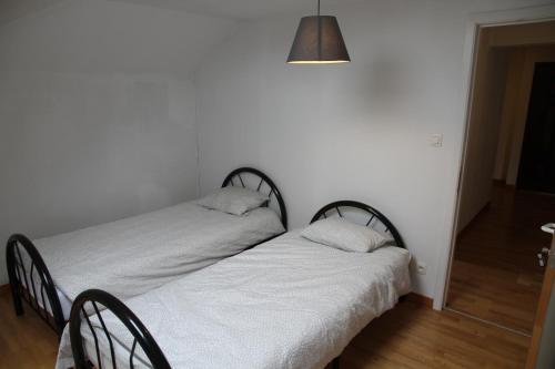 Postel nebo postele na pokoji v ubytování Appartement Courcelles