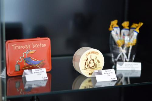 a table with a tray with a tray of items on it at Hotel Le Sevigne - Sure Hotel Collection by Best Western in Rennes