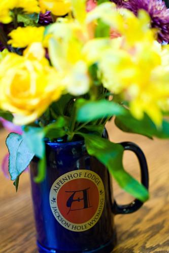 a blue coffee mug with yellow flowers in it at The Alpenhof in Teton Village