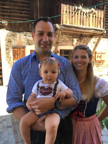 a man and woman posing for a picture with a baby at Alpen Adria Gasthof Rausch in Ledenitzen