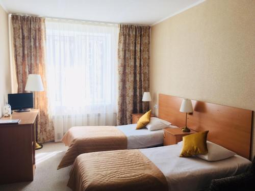 Кровать или кровати в номере Отель Звездный