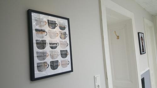 a framed picture of glasses on a wall at Boutique Hotel Kugel Wien in Vienna