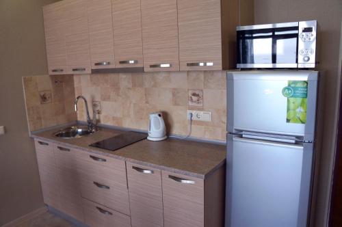 A kitchen or kitchenette at Sea View ORBI Residence