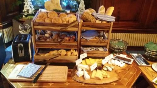 a table with a bunch of different types of bread at Hotel Krone in Schruns-Tschagguns