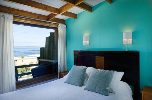 Tempat tidur dalam kamar di Cabañas, Habitaciones y Restaurant Montemar