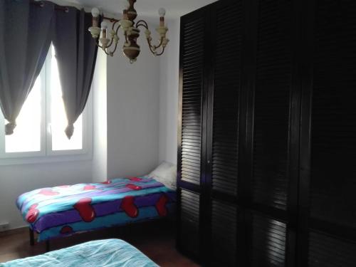 a bedroom with two beds and a window at mare e arte in Marina di Pisa