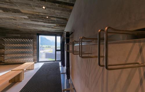 a wine tasting room with wooden walls and a window at Andermatt Alpine Apartments in Andermatt