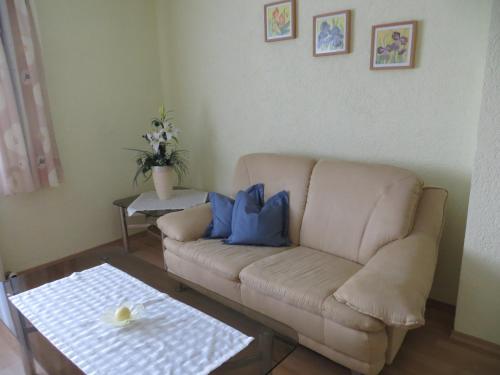 a living room with a couch and a table at Haus Spiessl in Bad Griesbach