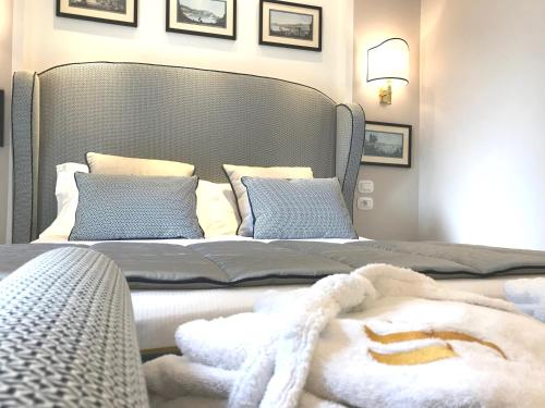 a bedroom with two beds with towels on them at Hotel Scapolatiello in Cava deʼ Tirreni