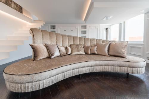 a large couch sitting in a living room at TOP Luxury Suites in Budapest